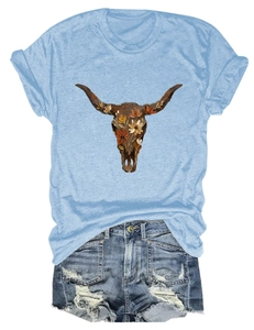 Detail of light blue t-shirt with floral bull skull print and vintage denim shorts