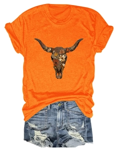 Detail of bohemian bull skull and flower print on bright orange cotton t-shirt