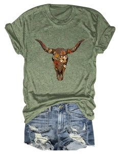 Flat lay of army green floral bull skull T-shirt with distressed denim shorts