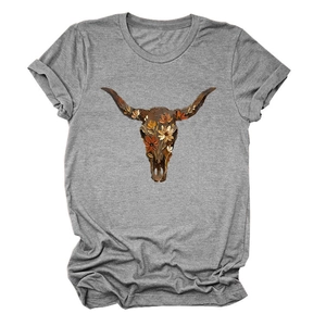 Close-up of bohemian grey T-shirt featuring a floral bull skull graphic and rolled sleeves