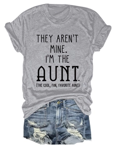 Flat lay of gray cotton T-shirt with black text and distressed blue denim shorts