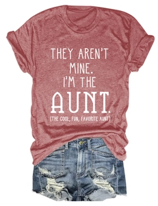 Close-up of brick red heathered t-shirt with white slogan and denim shorts detail