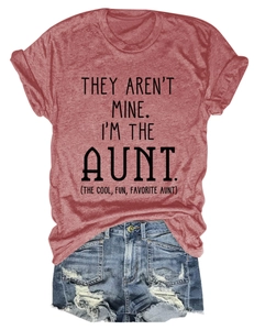 Flat lay of red aunt-themed crew neck T-shirt tucked into distressed denim shorts