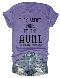 Close-up of purple t-shirt with text slogan paired with distressed denim shorts