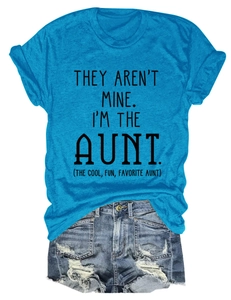 Detail of light blue crew neck T-shirt with black slogan and denim shorts on white background
