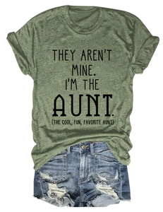 Flat lay of olive green crew neck T-shirt and distressed denim shorts with graphic text