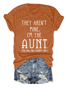 Close-up of caramel cotton T-shirt featuring funny auntie slogan print and rolled sleeves