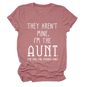 Close-up of funny white text print on a dusty rose cotton blend women's crew neck t-shirt