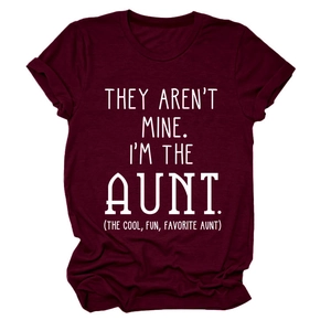 Detail of burgundy crew neck t-shirt featuring white typographic print on cotton fabric