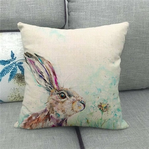 Detailed texture of linen cushion cover featuring artistic watercolor rabbit print