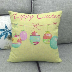 Detail of Happy Easter pink lettering and painted eggs on linen cushion cover