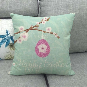 Detail of Happy Easter linen pillowcase with pink egg and floral branch on mint green fabric