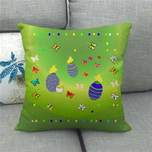 Detail of Easter linen pillow cover with yellow chick, colorful eggs and butterflies