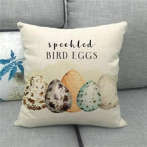 Close-up of linen pillowcase with speckled bird eggs print and vintage artistic text