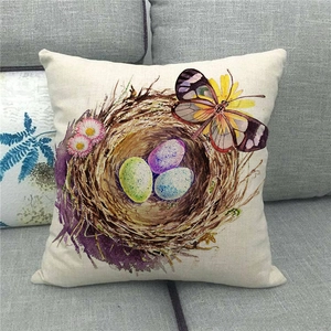 Detailed texture of linen pillowcase with colorful bird eggs and butterfly print