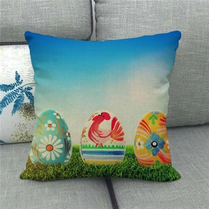 Close-up of Easter linen pillowcase with colorful eggs and rooster print on sofa
