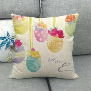 Close-up of Happy Easter linen pillowcase with colorful egg patterns on a sofa