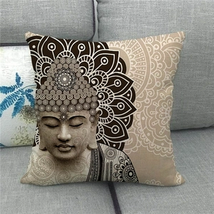 Detailed close-up of stone-carved Buddha and mandala pattern on linen pillow cover