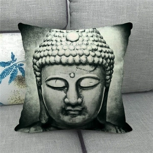 Zen Buddha face print linen pillowcase on sofa, artistic stone carving style decor