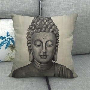 Detail view of linen pillowcase with Amitabha Buddha stone sculpture print on sofa