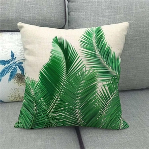 Linen pillow cover with green palm leaf print on beige textured fabric for home decor