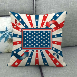 Linen pillow cover with US flag star and stripe pattern on a gray fabric sofa