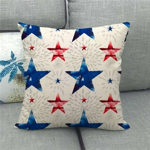 Close-up of linen pillow cover featuring red and blue stars with watercolor texture