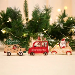 Close-up of wooden Christmas car ornaments with Merry Christmas lettering on tree