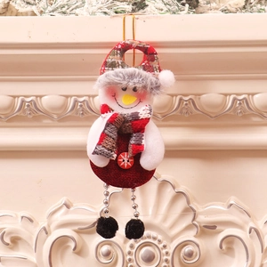Close-up of a Christmas snowman ornament with red burlap body and hanging silver chains