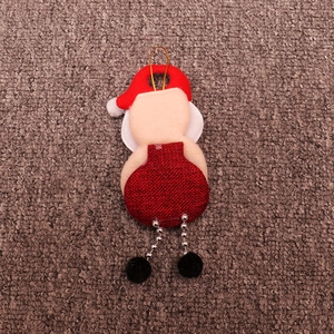 Detail of Santa Claus hanging ornament with red knit hat and silver bead chain legs