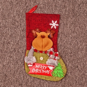 Close-up of a burlap Christmas stocking with 3D reindeer and Merry Christmas sign