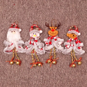 Detail of four Christmas plush ornaments with plaid fabric and small golden bells