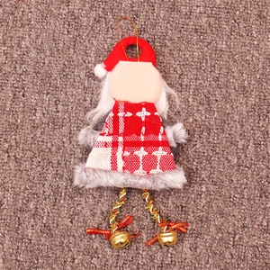 Detail of Santa plush ornament with red plaid shawl and golden bells for Christmas tree