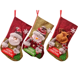 Three large Christmas stockings with Santa, Snowman, and Reindeer 3D designs for gifts