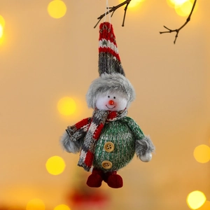 Christmas snowman ornament with green sequin body and red knit hat on a festive background