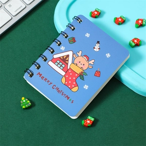 Detail of A7 Christmas spiral notebook with blue cartoon reindeer and snowman graphics