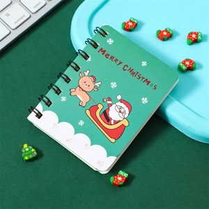 Detail of Christmas A7 pocket notebook with Santa illustration and green spiral binding