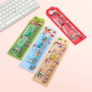 Christmas stationery gift sets including pencils and rulers in festive cartoon packaging
