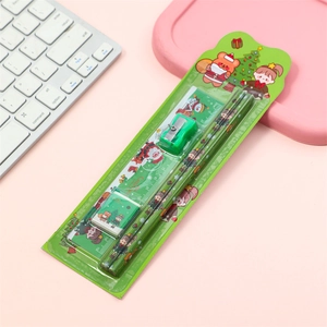 Close-up of 5-piece Christmas stationery set with pencils, ruler, eraser, and sharpener