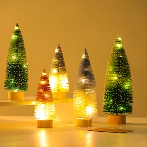 Mini LED Christmas trees with wooden bases and warm glowing lights for desk decor