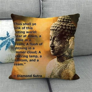 Zen Buddha linen throw pillow cover with Diamond Sutra scripture on gray sofa