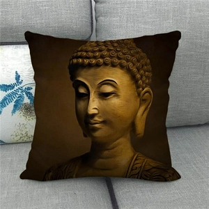Golden Buddha linen pillowcase on grey sofa for a minimalist zen home decor aesthetic