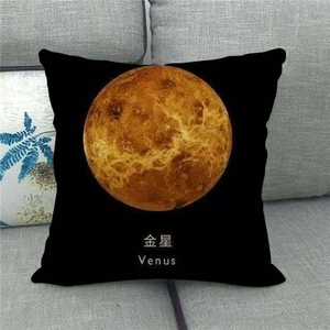 Detailed view of black linen pillowcase with realistic Venus planet print on grey sofa
