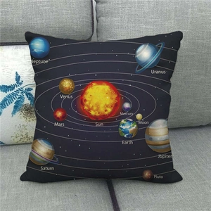 Linen pillow cover with solar system planets and galaxy stars on a gray sofa