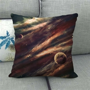 Detail view of linen pillowcase with galaxy nebula and planet print on a grey sofa