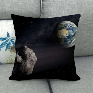 Close-up of linen pillowcase with cosmic space print featuring Earth and asteroid textures