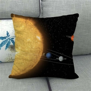 Detail of galaxy linen pillow cover with solar system planets on a gray sofa