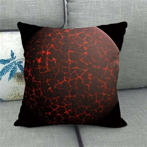Detailed view of galaxy themed linen pillowcase with lava texture on a grey sofa
