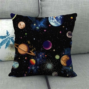 Space galaxy planet linen throw pillow case featuring Earth and Saturn on a grey sofa