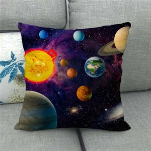 Detail of galaxy linen pillowcase with solar system planets on a gray sofa